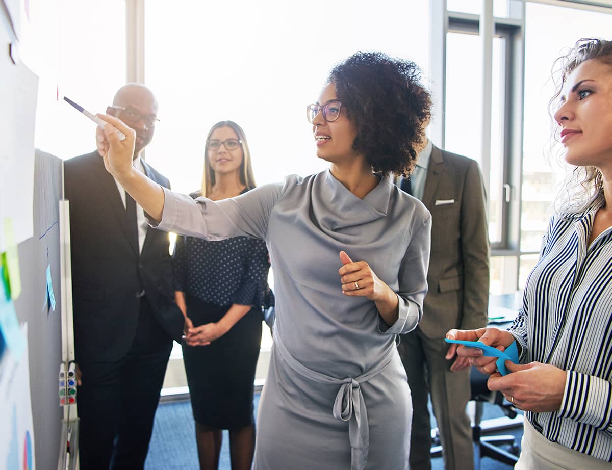 diverse group focused business people brainstorming together