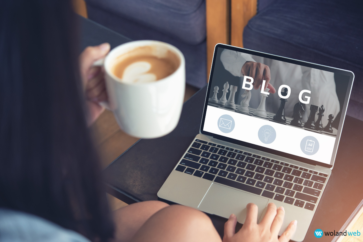 person holding coffee while using a laptop with the text